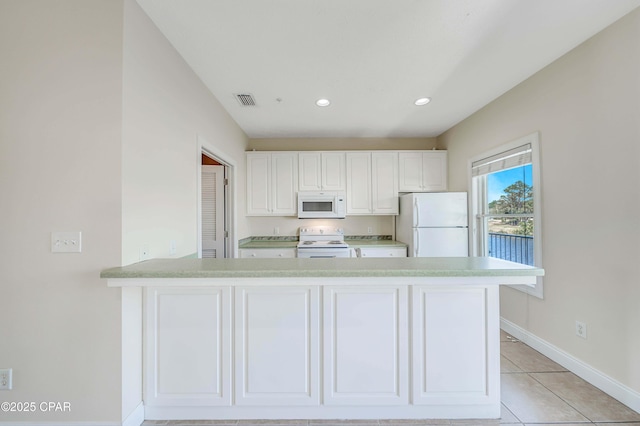 kitchen with visible vents, baseboards, white cabinetry, white appliances, and light countertops