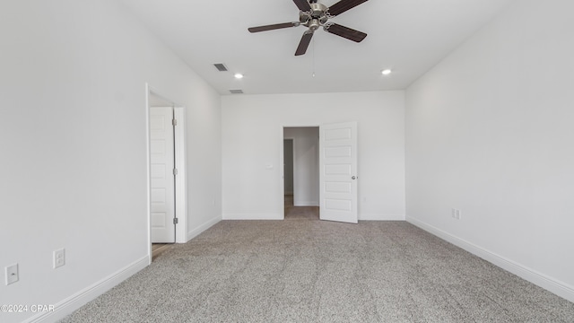 carpeted spare room with a ceiling fan, baseboards, visible vents, and recessed lighting