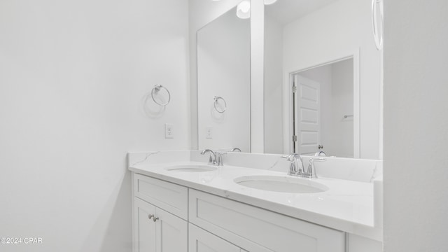 bathroom featuring double vanity and a sink