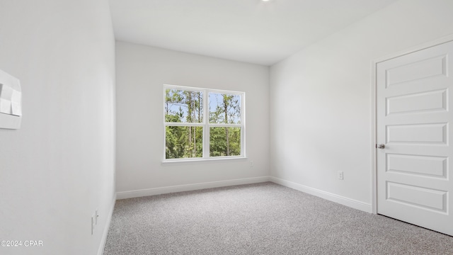 spare room with carpet floors and baseboards
