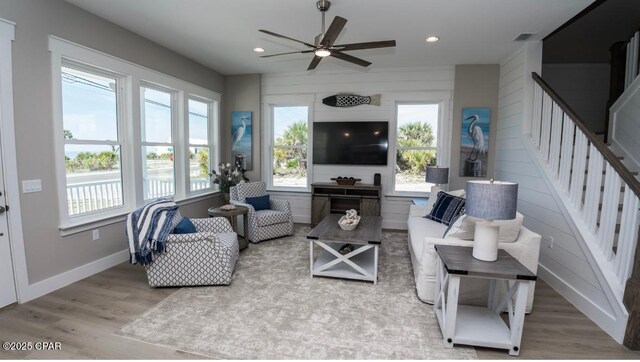 244 Sands St, Panama City Beach, FL 32413 - living area with wood finished floors, a ceiling fan, stairway, recessed lighting, and baseboards