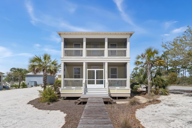 raised beach house with a balcony