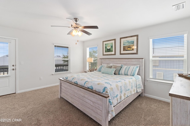 bedroom with light carpet, visible vents, and baseboards