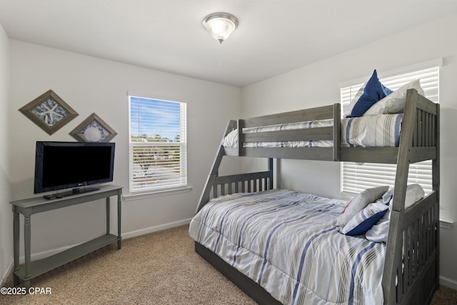 carpeted bedroom with baseboards