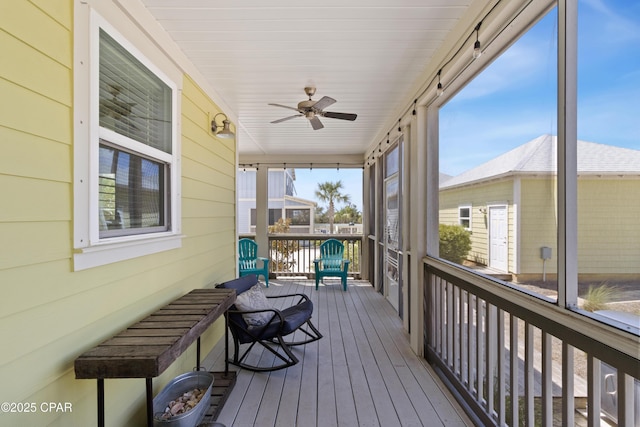 sunroom / solarium with ceiling fan