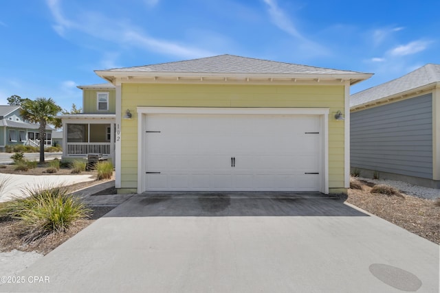 garage with concrete driveway