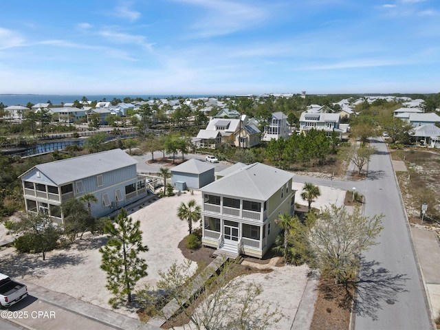 aerial view featuring a residential view and a water view
