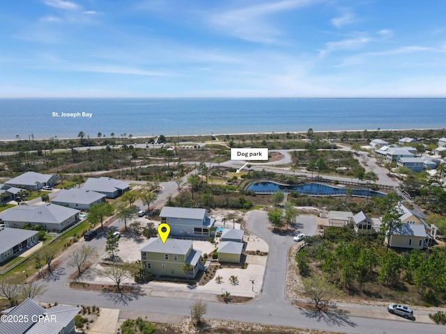 aerial view with a water view and a residential view
