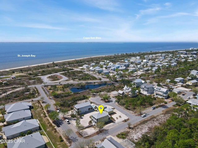 bird's eye view with a residential view and a water view