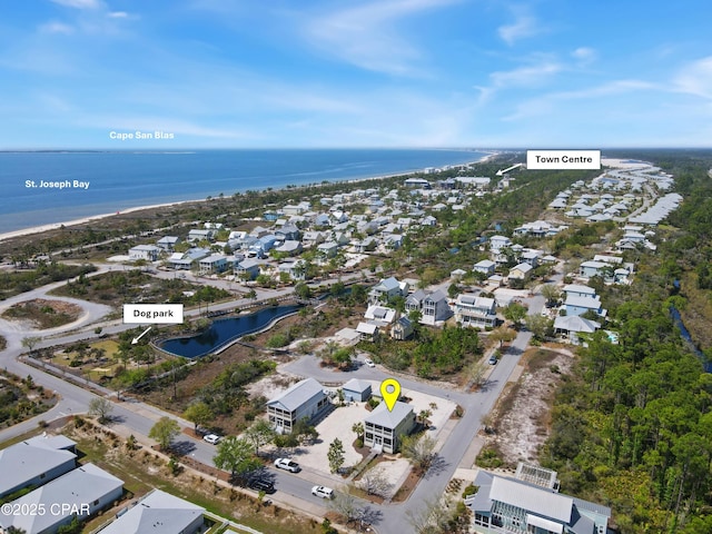 aerial view featuring a water view and a residential view