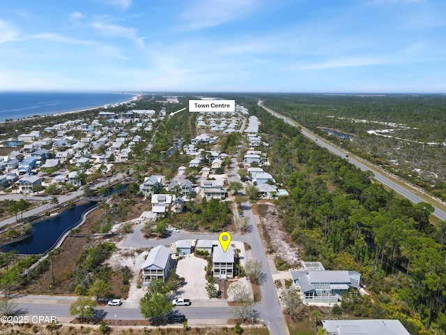 drone / aerial view featuring a water view and a residential view