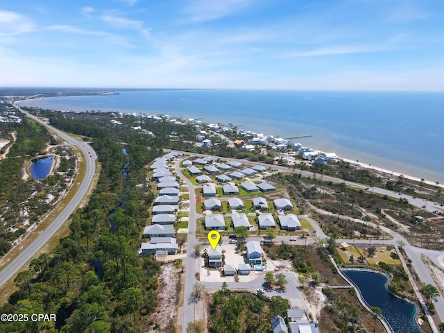 birds eye view of property featuring a water view and a residential view
