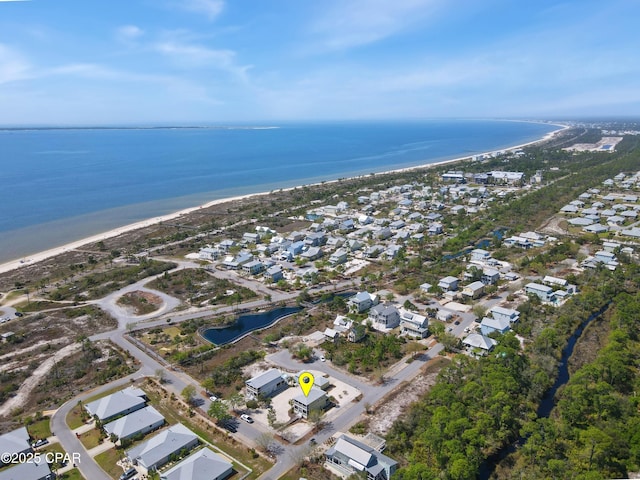 drone / aerial view featuring a water view and a residential view