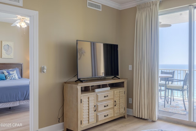 17643 Front Beach Rd Unit 1805, Panama City Beach, FL 32413 - bedroom with light wood-style flooring, baseboards, ornamental molding, and access to exterior