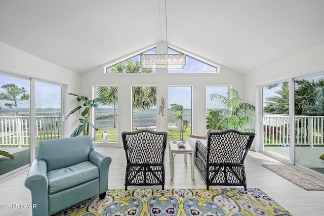7124 Leeward St, Port St Joe, FL 32456 - sunroom / solarium featuring lofted ceiling, a water view, and wood finished floors