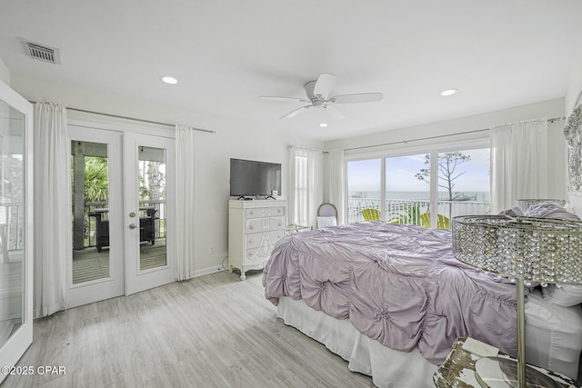 7124 Leeward St, Port St Joe, FL 32456 - bedroom featuring french doors, access to exterior, multiple windows, and recessed lighting