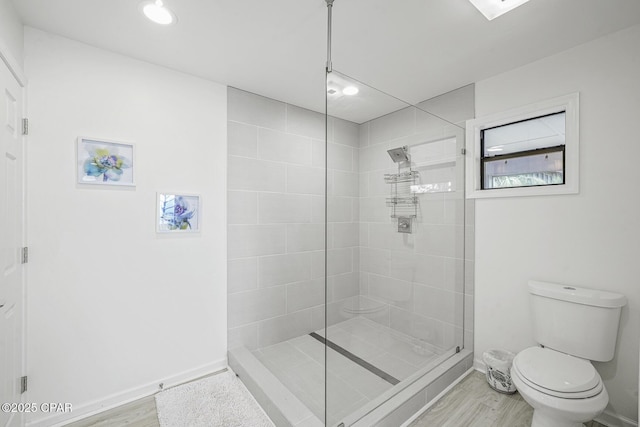 7124 Leeward St, Port St Joe, FL 32456 - full bath featuring wood finished floors, toilet, a walk in shower, baseboards, and recessed lighting