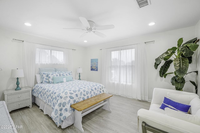 7124 Leeward St, Port St Joe, FL 32456 - bedroom with multiple windows, light wood-style flooring, recessed lighting, and a ceiling fan