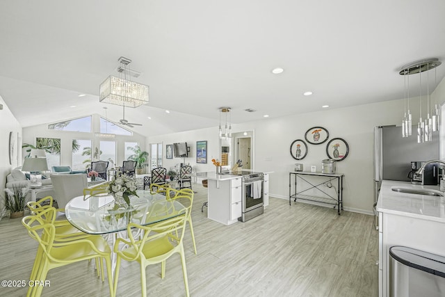 7124 Leeward St, Port St Joe, FL 32456 - dining space featuring a ceiling fan, light wood-type flooring, lofted ceiling, recessed lighting, and baseboards