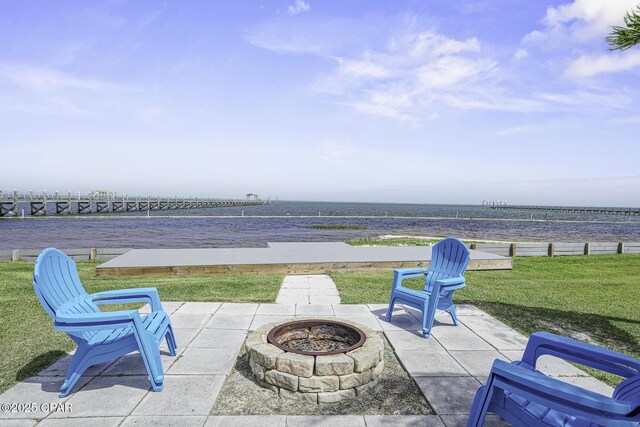 7124 Leeward St, Port St Joe, FL 32456 - view of patio featuring an outdoor fire pit and a water view