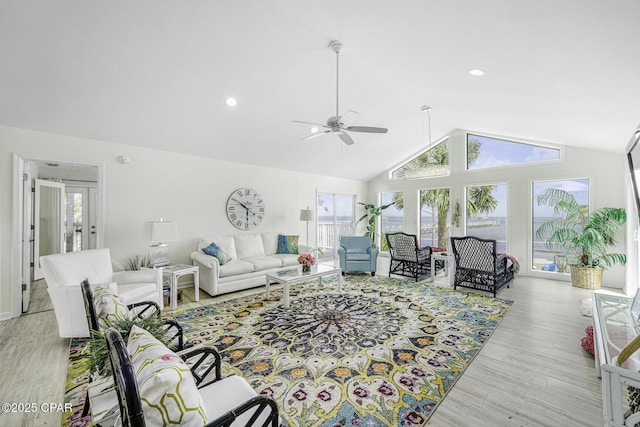 7124 Leeward St, Port St Joe, FL 32456 - living room featuring ceiling fan, light wood-style flooring, and high vaulted ceiling