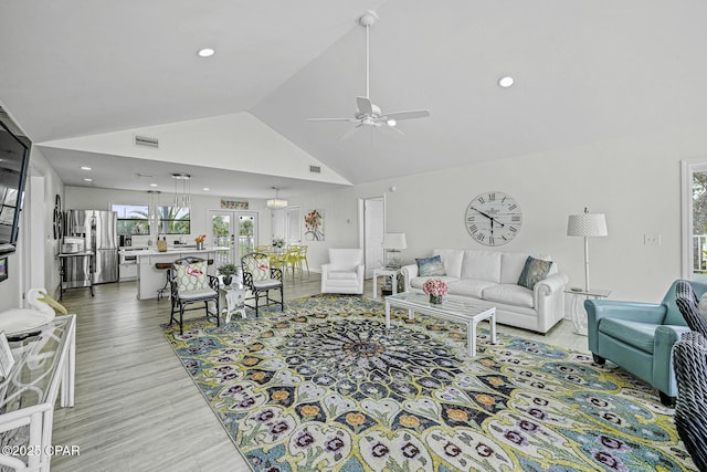 7124 Leeward St, Port St Joe, FL 32456 - living area with ceiling fan, light wood finished floors, recessed lighting, and high vaulted ceiling