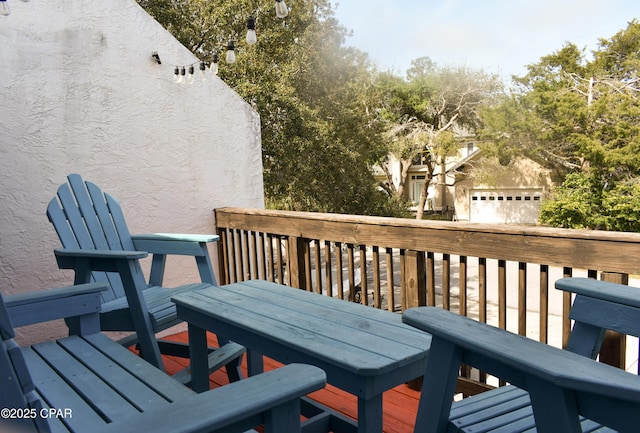 wooden terrace featuring outdoor dining space