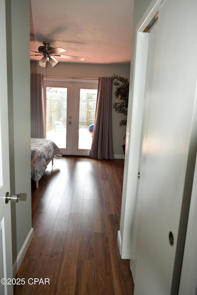 bedroom with hardwood / wood-style floors, access to exterior, french doors, baseboards, and ceiling fan