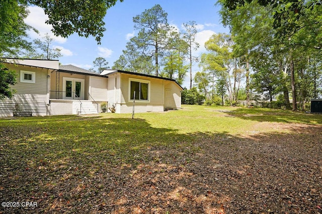 view of yard with french doors