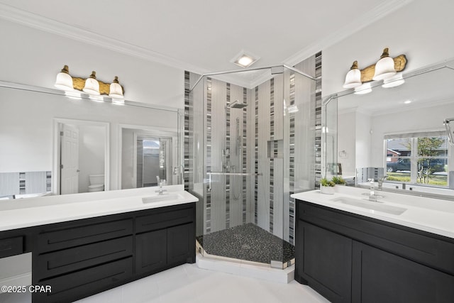 2015 Tupelo Ct, Panama City, FL 32405 - full bathroom with a shower stall, two vanities, a sink, and ornamental molding