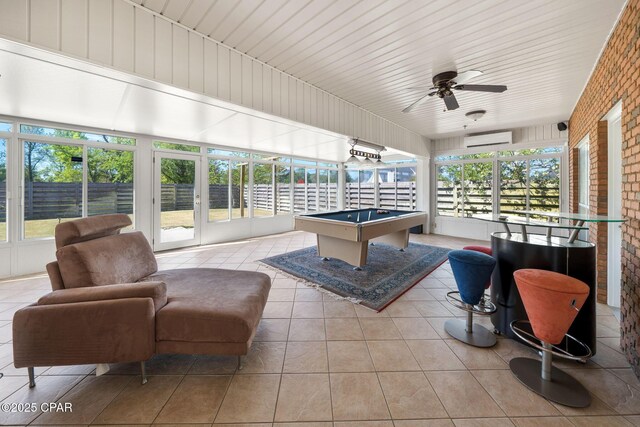 2015 Tupelo Ct, Panama City, FL 32405 - rec room with billiards, a wall mounted air conditioner, tile patterned floors, brick wall, and a ceiling fan