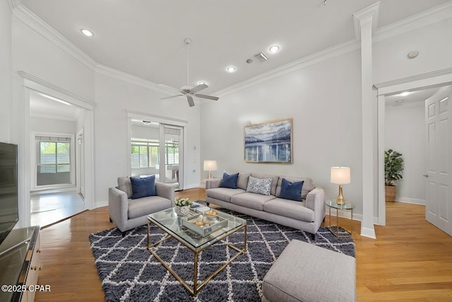 2015 Tupelo Ct, Panama City, FL 32405 - living area featuring visible vents, baseboards, ceiling fan, crown molding, and light wood-style flooring