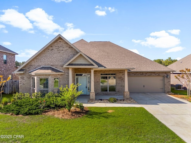 31 Viper Rd, Santa Rosa Beach, FL 32459 - view of front of property with roof with shingles, a front lawn, brick siding, an attached garage, and concrete driveway