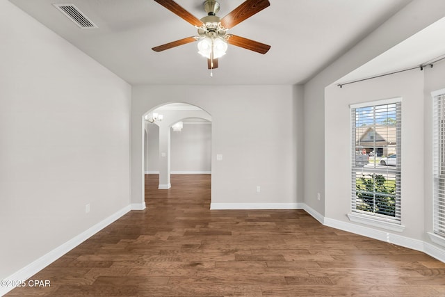 31 Viper Rd, Santa Rosa Beach, FL 32459 - unfurnished room featuring visible vents, baseboards, arched walkways, a ceiling fan, and wood finished floors