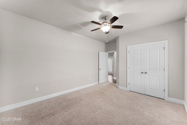 31 Viper Rd, Santa Rosa Beach, FL 32459 - unfurnished bedroom with a closet, baseboards, visible vents, a ceiling fan, and carpet