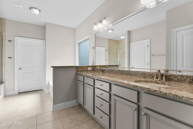 31 Viper Rd, Santa Rosa Beach, FL 32459 - bathroom featuring a tile shower, baseboards, and a sink