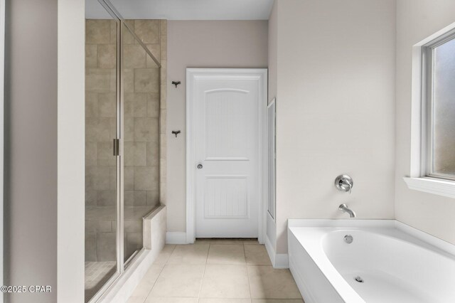 31 Viper Rd, Santa Rosa Beach, FL 32459 - full bath with tile patterned floors, a bath, a shower stall, and baseboards