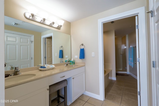 bathroom with visible vents, a sink, a shower, double vanity, and tile patterned flooring
