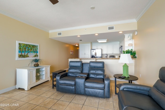 living room featuring ornamental molding, visible vents, and light tile patterned floors