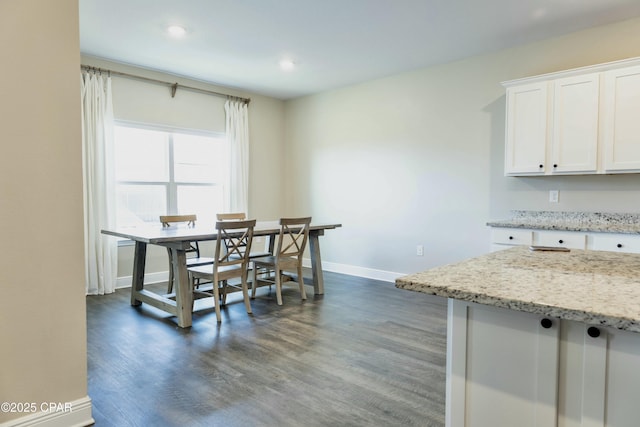 dining space with recessed lighting, baseboards, and dark wood finished floors