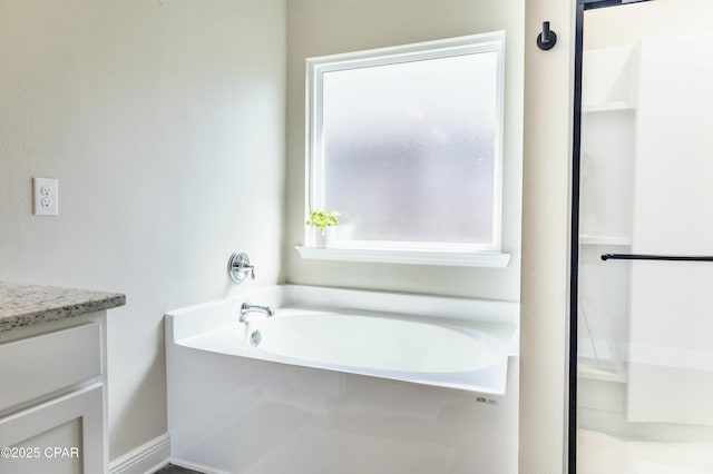 full bath with a garden tub, a shower, and vanity