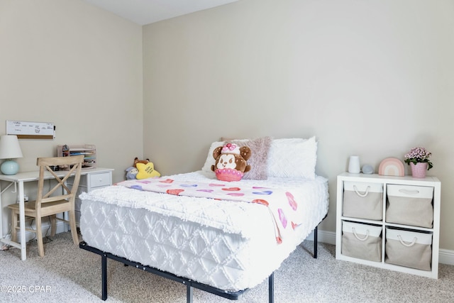 bedroom with carpet and baseboards
