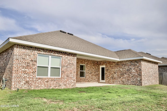 4745 Rosemary St, Panama City, FL 32404 - rear view of house with a lawn, a patio area, brick siding, and an outdoor living space