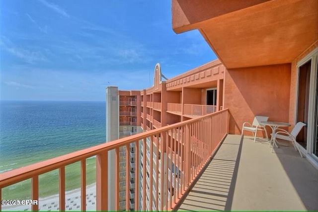 balcony featuring a water view