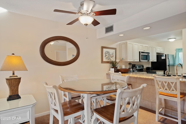 520 N Richard Jackson Blvd Unit 2209, Panama City Beach, FL 32407 - dining area featuring baseboards, recessed lighting, a textured ceiling, a ceiling fan, and visible vents