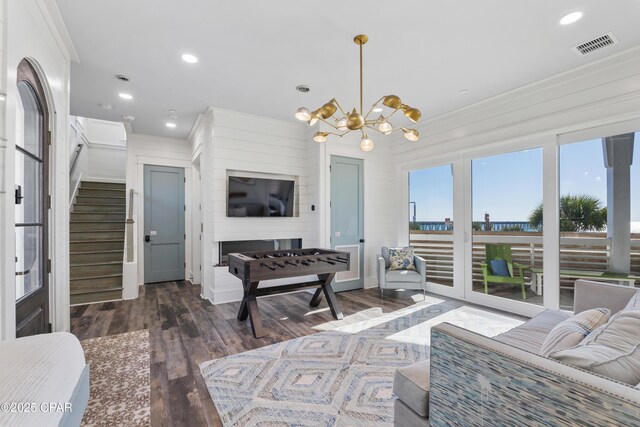 12401 Front Beach Rd, Panama City Beach, FL 32407 - living room featuring visible vents, a chandelier, recessed lighting, wood finished floors, and stairs