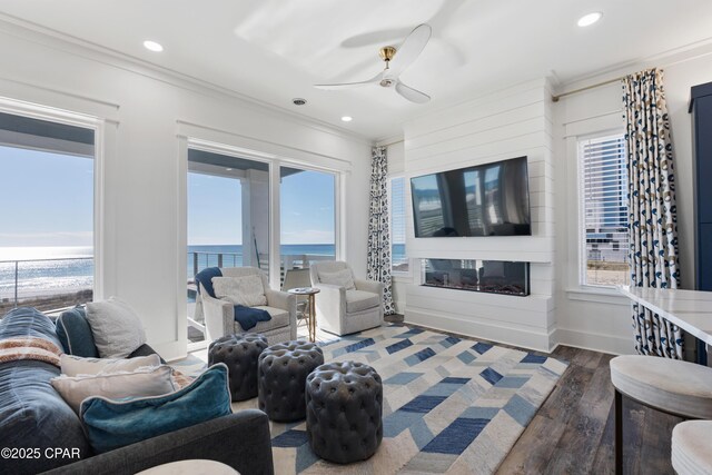 12401 Front Beach Rd, Panama City Beach, FL 32407 - living area with crown molding, ceiling fan, recessed lighting, wood finished floors, and baseboards