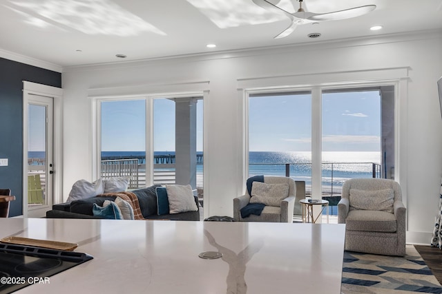 12401 Front Beach Rd, Panama City Beach, FL 32407 - dining area with recessed lighting, ceiling fan, ornamental molding, and a water view
