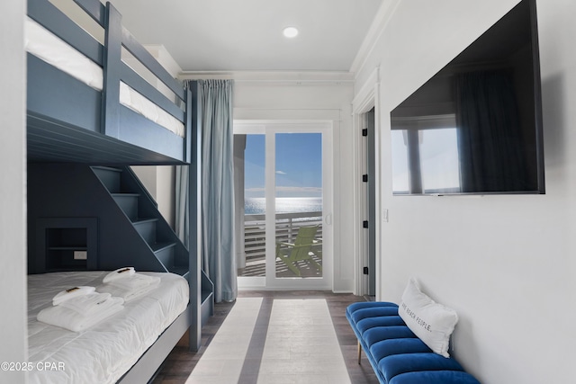 12401 Front Beach Rd, Panama City Beach, FL 32407 - bedroom featuring crown molding, access to exterior, and wood finished floors