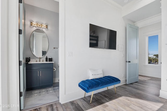 12401 Front Beach Rd, Panama City Beach, FL 32407 - bathroom with wood finished floors, vanity, and baseboards